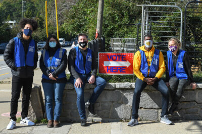 ACLU legal observers sit by a "Vote Here" sign outside a polling place in Georgia on Election Day.