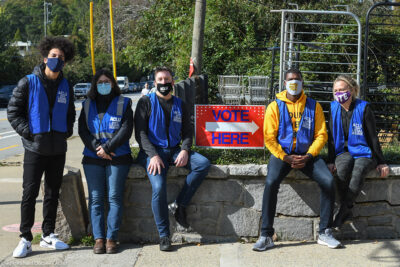 ACLU legal observers sit by a "Vote Here" sign outside a polling place in Georgia on Election Day.