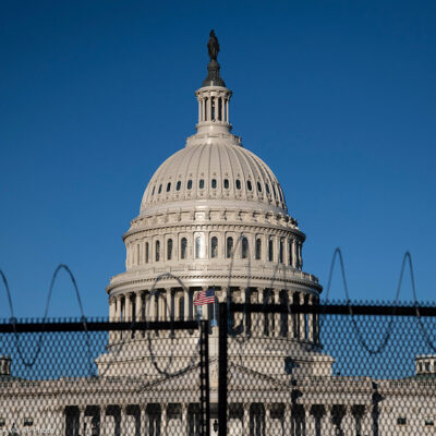 Black fence in front of Capitol building in Washington, DC.
