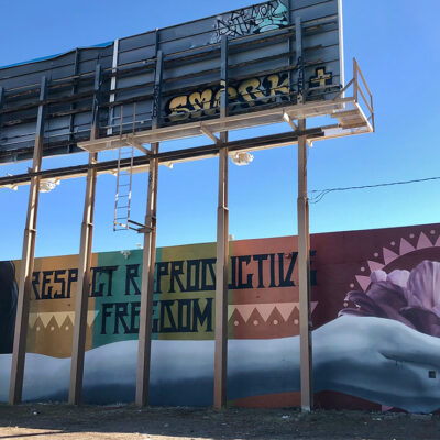 A mural with the text "Respect Reproductive Freedom."