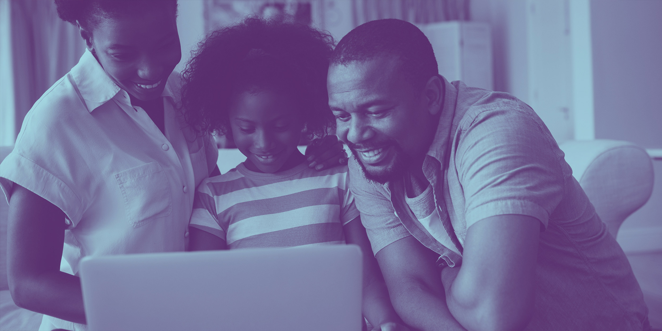 A picture of a black family smiling together as they stare at a computer, with a blue overlay on the photo.