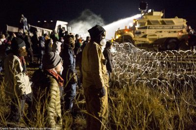 Police use a water cannon to drench opponents of the Dakota Access oil pipeline during a standoff in freezing temperatures on Backwater Bridge near the pipeline route on November 20, 2016. Cannon Ball, North Dakota