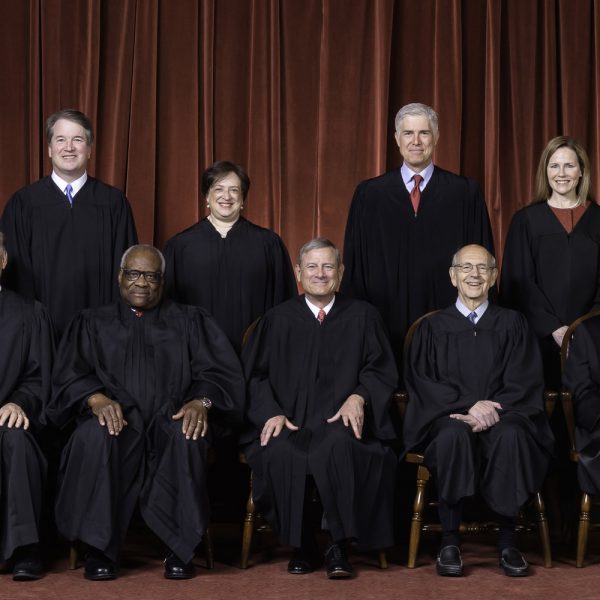 Photo of the Supreme Court Justices in black robes as composed October 27, 2020.