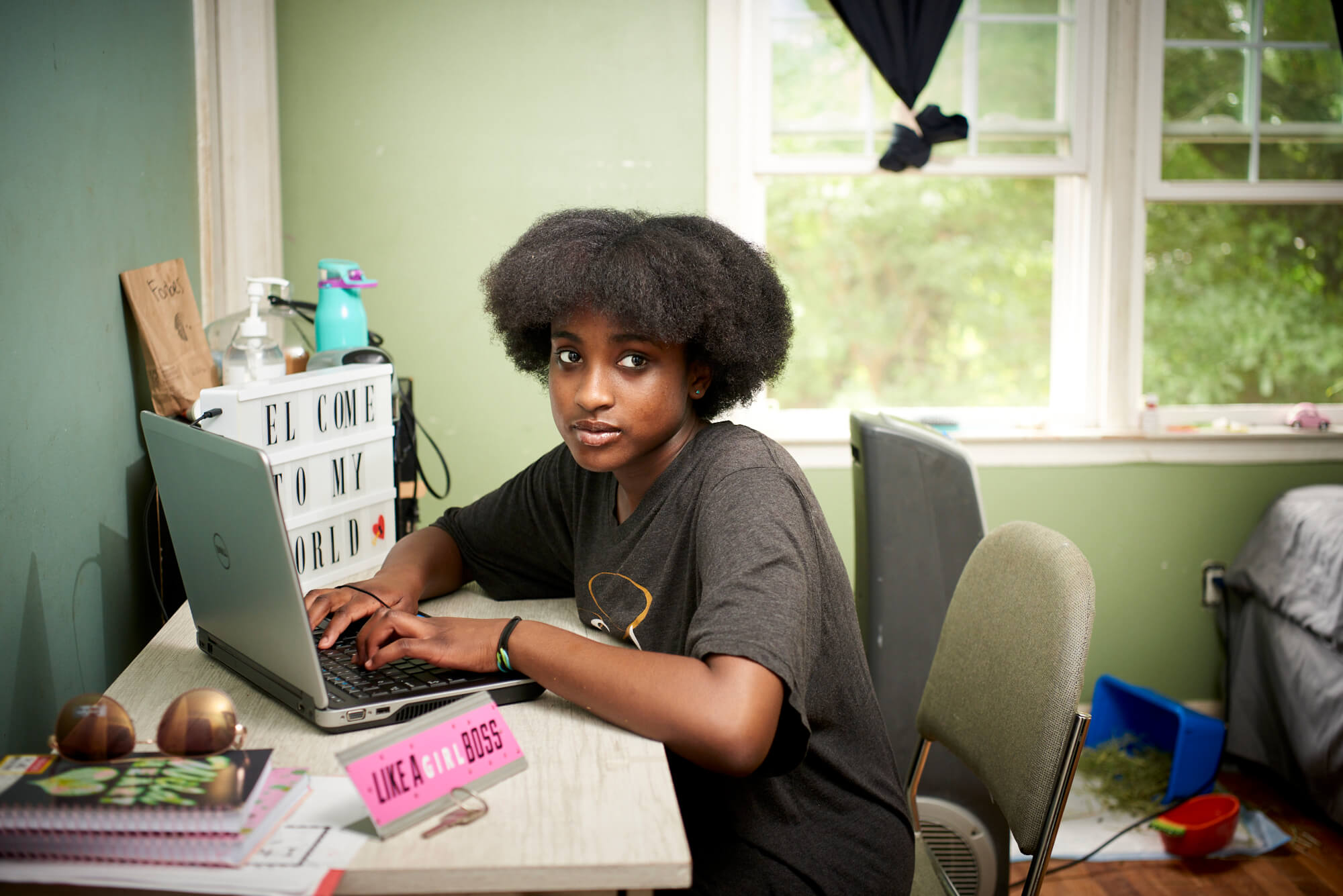 Child at desk with laptop