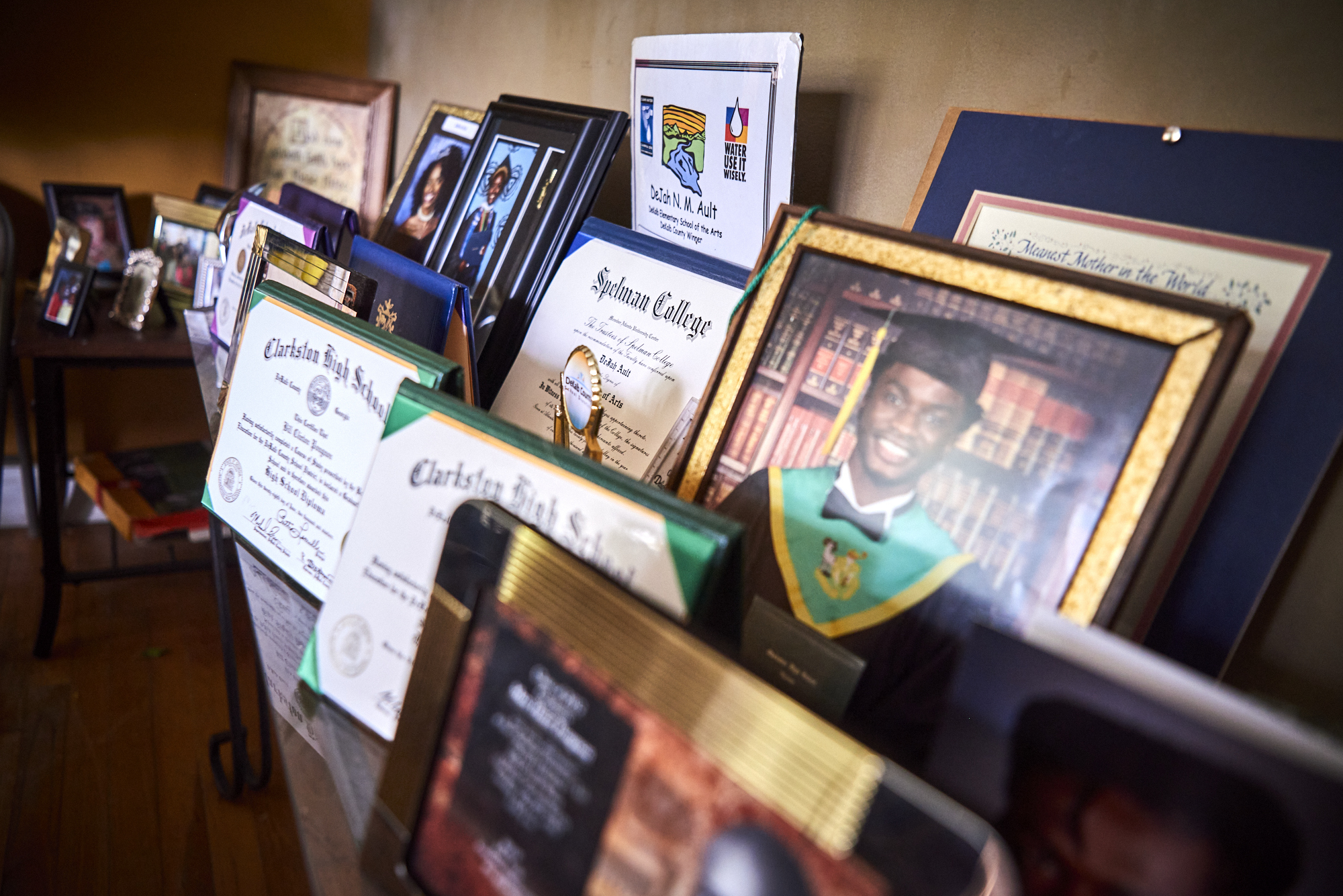 Pictures and diplomas in Kim Ault's home