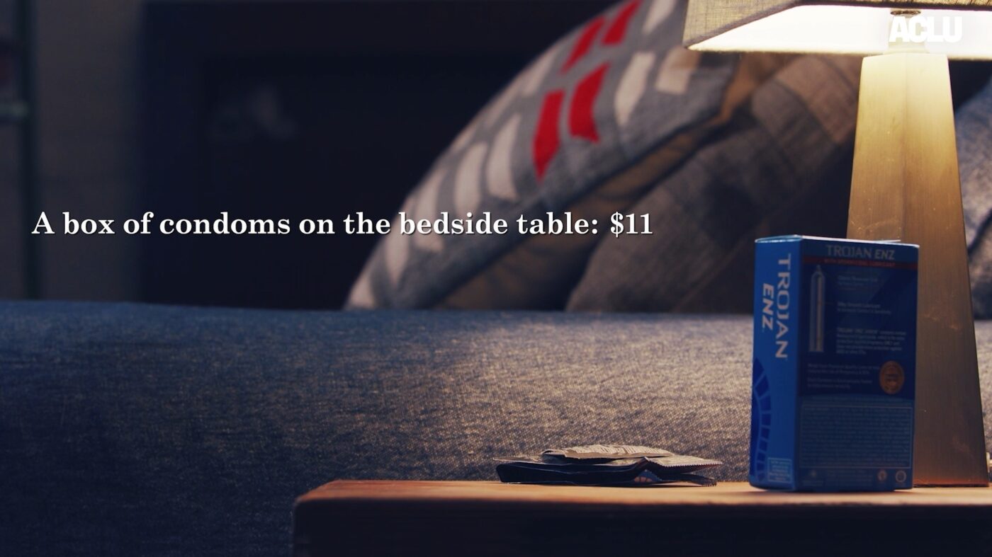 A box of Trojan condoms on a bedside table next to the phrase "A box of condoms on the bedside table: 11$"