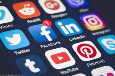 Social media icons on a smartphone screen.