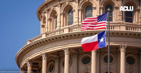 American and Texas state flags flying on the dome of the Texas State Capitol building.
