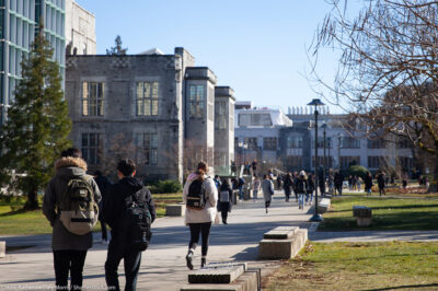 Students walking down a campus.