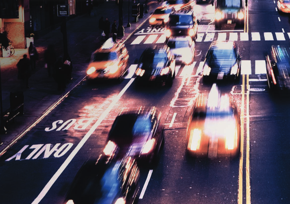 A highway with fast moving cars.