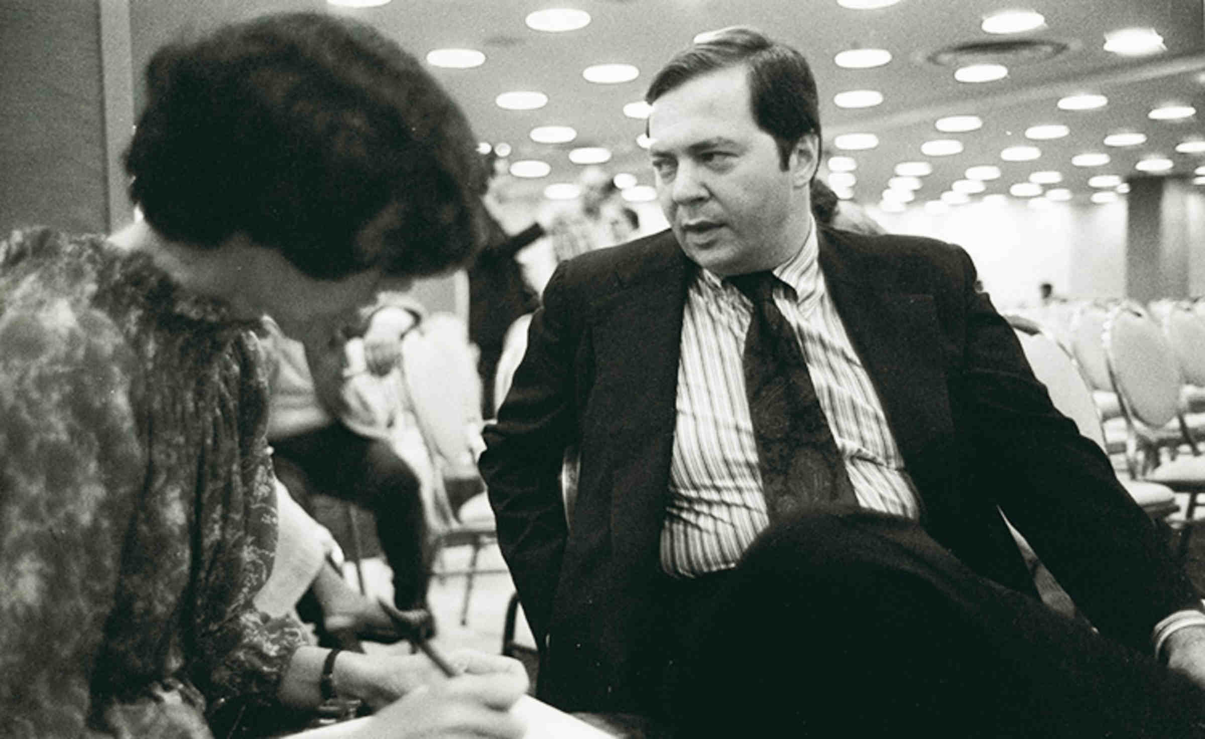 Aryeh Neier speaking to someone