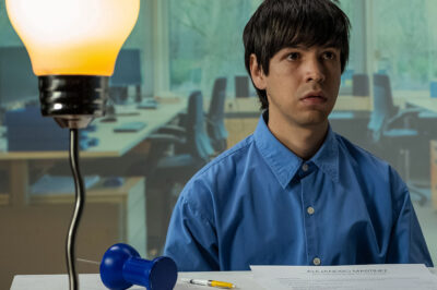 Still of Julio Torres as Alejandro Martinez in the movie Problemista.