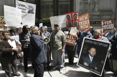 A group of demonstrators rally outside Chicago's City Hall