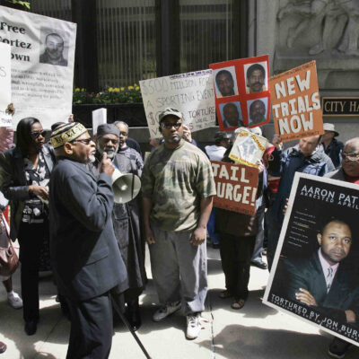 A group of demonstrators rally outside Chicago's City Hall