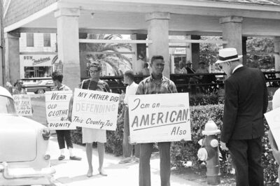 Demonstrators march in front of the old slave market, May 30, 1964, St. Augustine, Fla.
