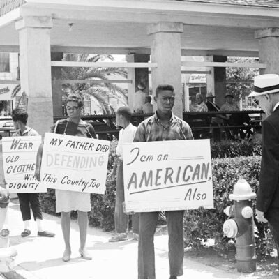 Demonstrators march in front of the old slave market, May 30, 1964, St. Augustine, Fla.