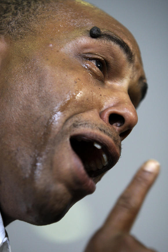 A close up of the face of a man talking