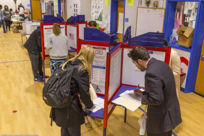 Voters fill out paper ballots on election day.