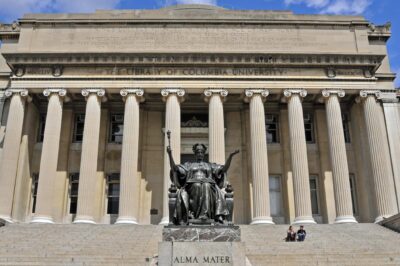 Facade of the Columbia University Library with the ALMA MATER statue in the foreground.