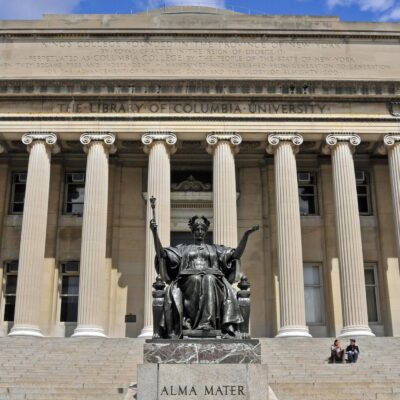 Facade of the Columbia University Library with the ALMA MATER statue in the foreground.