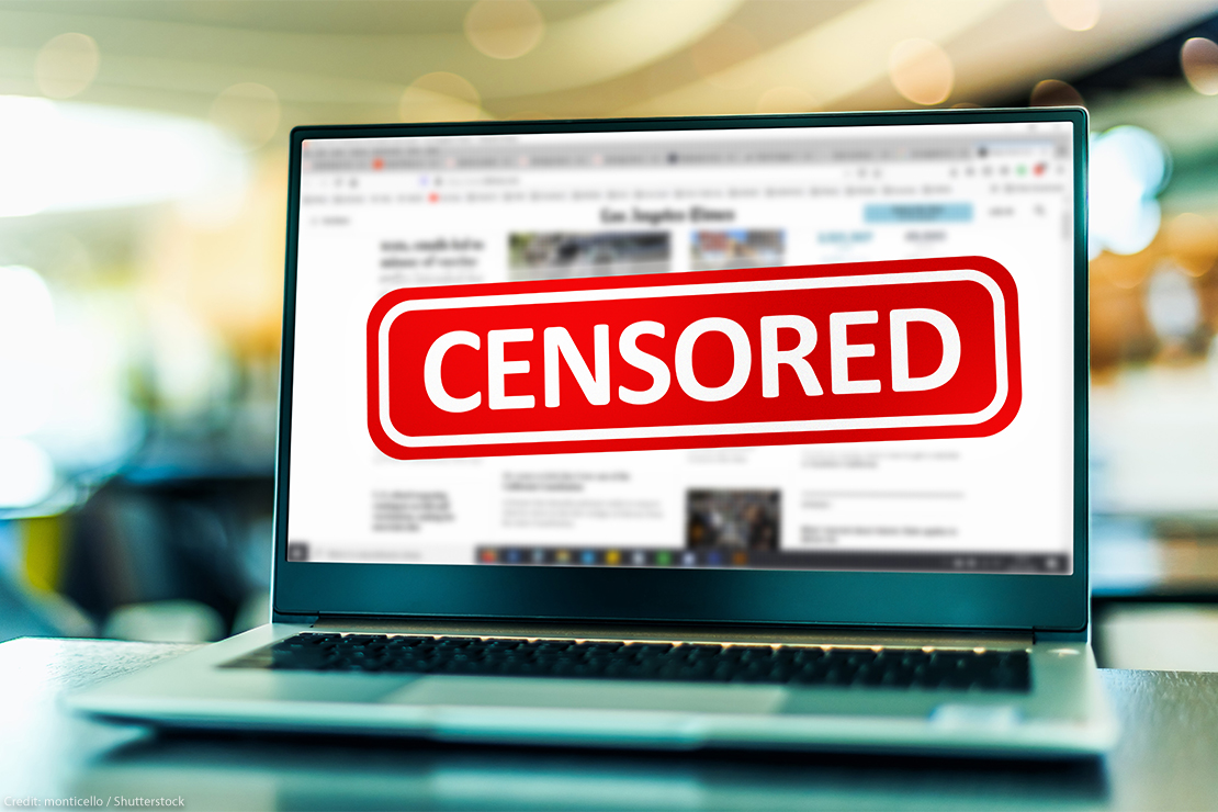 Laptop computer displaying the sign of censorship on an internet news site.
