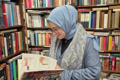 Rümeysa Öztürk reads an art book.