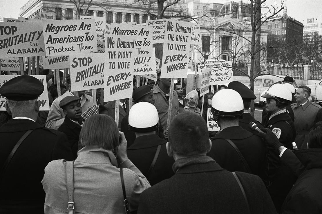 On March 12, 1965, African Americans gathered outside the White House to protest in solidarity with the Selma demonstrators. They held signs reading, "WE DEMAND THE RIGHT TO VOTE, EVERYWHERE!" and "STOP BRUTALITY IN ALABAMA”.