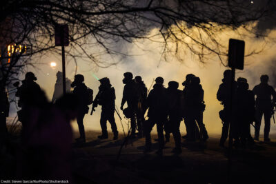 Federal law enforcement deploys gas at the site of a reported shooting in North Minneapolis.